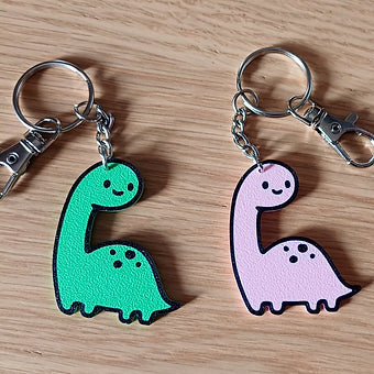 2er Set Niedliche Dino Schlüsselanhänger – Rosa & Grün
